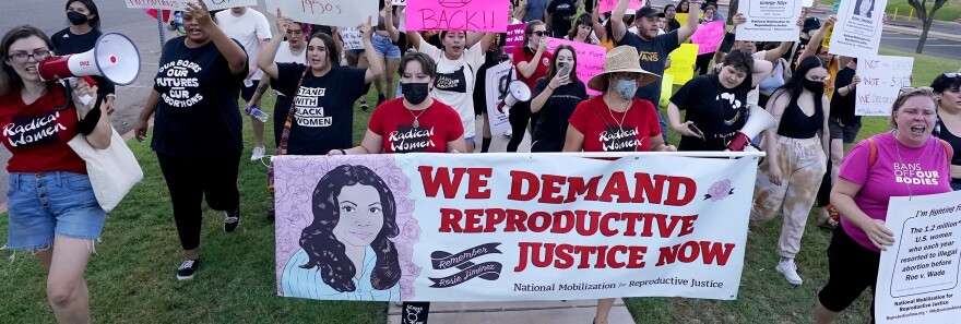 FILE - Thousands of protesters march around the Arizona Capitol in protest after the Supreme Court decision to overturn the landmark Roe v. Wade abortion decision Friday, June 24, 2022, in Phoenix. A stunning abortion ruling this week in April 2024, has supercharged Arizona’s role in the looming fall election. (AP Photo/Ross D. Franklin, File)