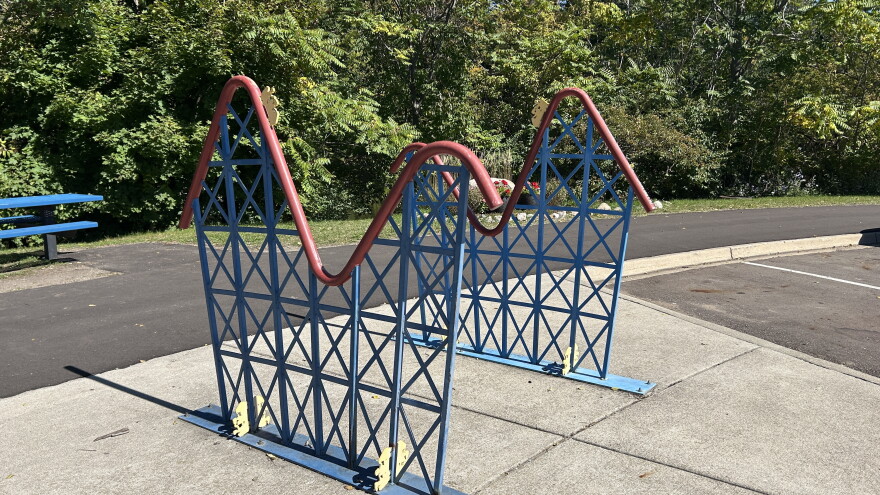 Two bike racks shaped like a roller coaster