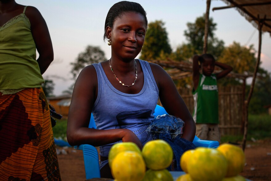 Just off Ganta's main street, 18-year-old orange seller Bebe Gono says she's struggling. "We are trying to find the little we can afford," she says.