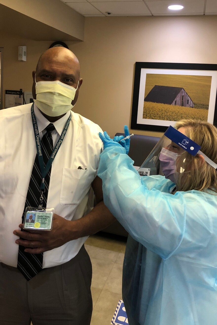 Shelby County's health officer, Dr. Bruce Randolph, receives a COVID-19 vaccine. 