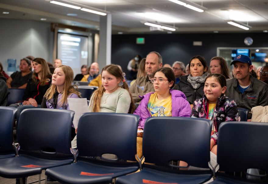 Students a a board meeting.