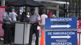 Officers stand outside the Immigration and Customs Enforcement (ICE) offices, Wednesday, July 26, 2023, in Miramar, Fla.