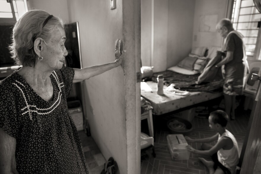 Narcisa Claveria, watches husband, Anaceto, and their great-grandson as he wakes up from a nap at their home in Manila. At age 12, Narcisa was dragged from her home by Japanese soldiers and forced to serve as a sex slave in a garrison for 1 1/2 years. At a time when the experience was seen as a mark of shame, her husband encouraged her to share her story and told her: "I am not repulsed by you."