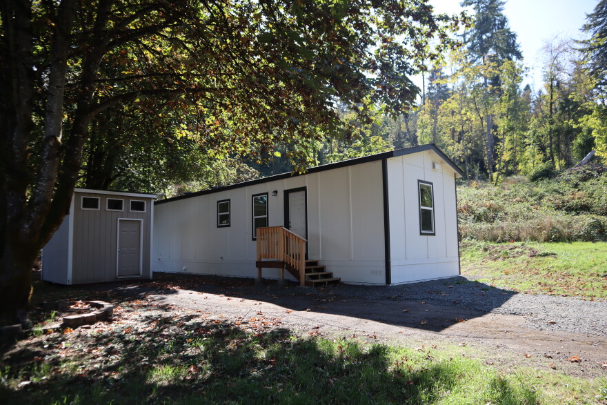 In this Sept. 18, 2026 phot, a two-bedroom HOPE Home—along with a storage building—sits in the back of Saginaw Mobile Home Park, backing into a wooded area.
