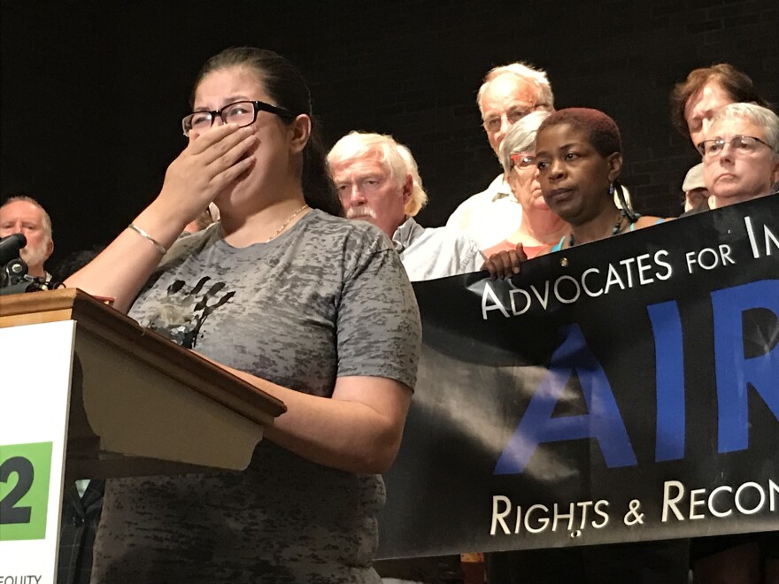At a news conference Tuesday afternoon, Cheyenne Hoyt weeps as she recounts what happened to the father of her two children. 