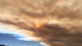  Wildfire smoke above Leadville makes the sun appear a dark shade of red in 2021. 
