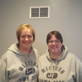 KL Biggerstaff and her mom, Debbie Hawk, smile in matching WITCC sweatshirts.