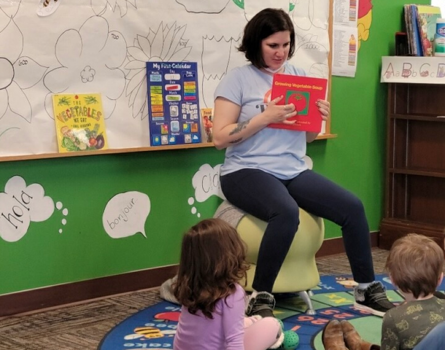 Brittany ReoNason reads to kids