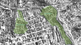 Black and white aerial map of downtown Athens with two areas shaded green and labeled The Bottom and Lickskillet,