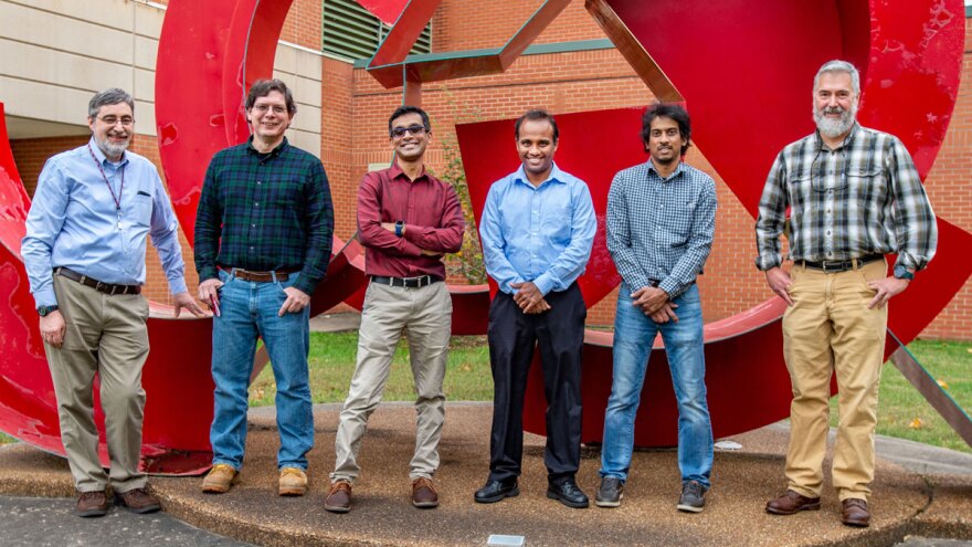 Scott D. Hamilton-Brehm and Lahiru Jayakody, second and third from left, received statewide awards for innovation at the 2022 STEAM Expo at the Illinois State Fair in Springfield. 