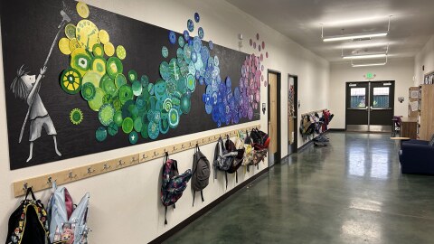 Student art and backpacks line the main corridor at Plumas Charter School, a tiny K-12 campus in Quincy, California, with about 350 students.