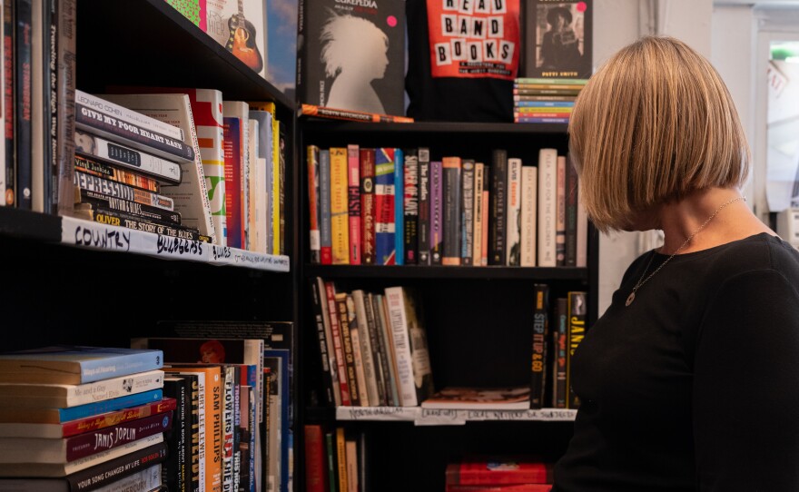 Virginia Sloop browsing the stacks at Read Band Books