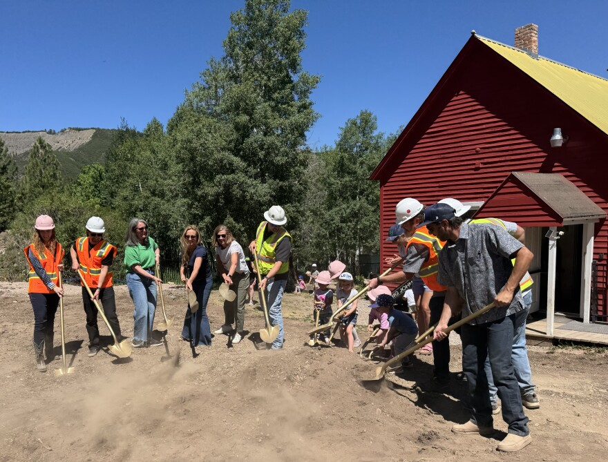 Childcare leaders and children break ground at the site of the new Little Red Schoolhouse expansion on June 17, 2026. The project is set to be completed in 14 months and will increase the childcare facility’s capacity from 24 to 60 children.