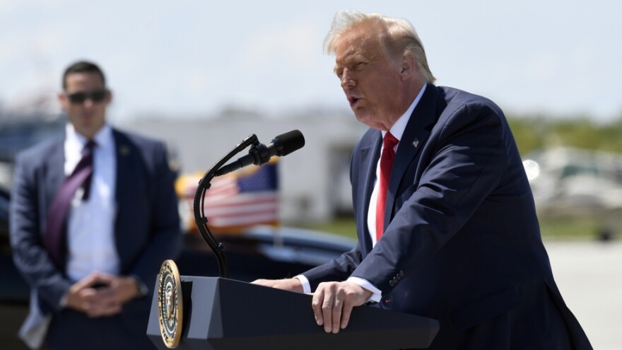 Then-President Donald Trump speaks on the tarmac of Burke Lakefront Airport in Cleveland in August 2020. [Susan Walsh / AP] 