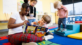 Owner Dana Luster, 42, reads to Louis, 3, Grace (in ponytails), 3, and John, 1, on Thursday, March 23, 2023, at Little D’s Home Daycare in Bella Villa.