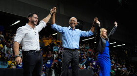 Former President Barack Obama, center, joined by Democratic nominee for U.S. Senate Abdul El-Sayed, left, and Democratic gubernatorial nominee and Michigan Secretary of State Jocelyn Benson raise hands during a campaign event at Cass Technical High School Saturday, Oct. 24, 2026, in Detroit.