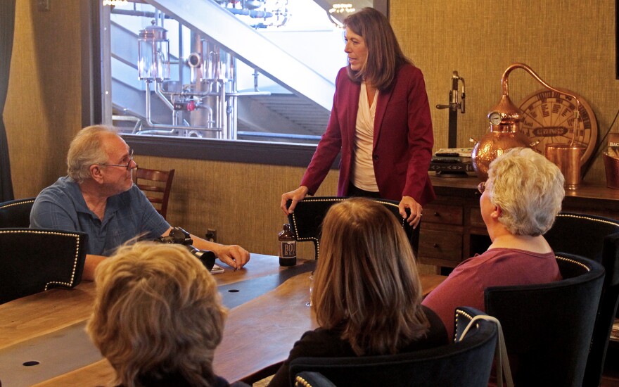 Rep. Cindy Axne answers voters’ questions at a campaign meet up held at the Revelton Distillery in Osceola on Oct. 11, 2022.