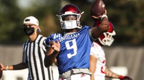 Indiana quarterback Michael Penix throws during an Aug. 6 practice outside Memorial Stadium.