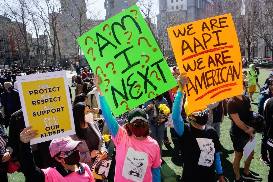 People take part in a rally against hate and confront the rising violence against Asian Americans at Columbus Park in the Chinatown section of Manhattan borough of New York, on Sunday, March 21, 2021.