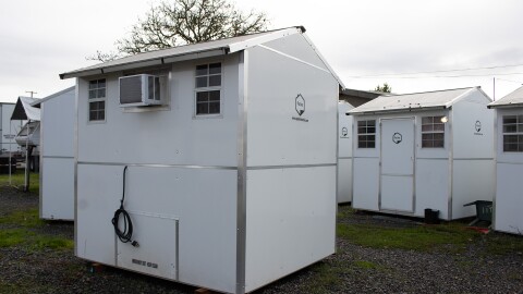 Two pallet homes seen on Nov. 20, 2025 that previously housed Sandbox residents now sit empty after the site lost state funding.