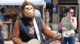 Bigfoot playing acoustic guitar