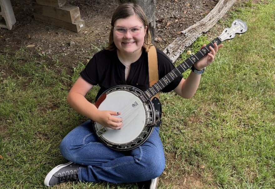 Banjo player Alanabeth Duncan poses for a picture in Elkton, VA., this summer.