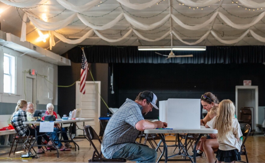 Jake and Eva Hepokoski vote along with their two daughters at Nimrod Community Center on Primary Election Day, Aug. 11, 2026.
