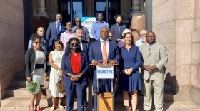 Darrick Dansby, at podium, became president of the Charter Committee in spring 2021.