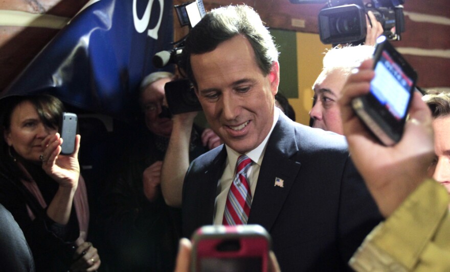 Republican presidential candidate Rick Santorum speaks during his caucus night rally in Johnston, Iowa, on Tuesday. 