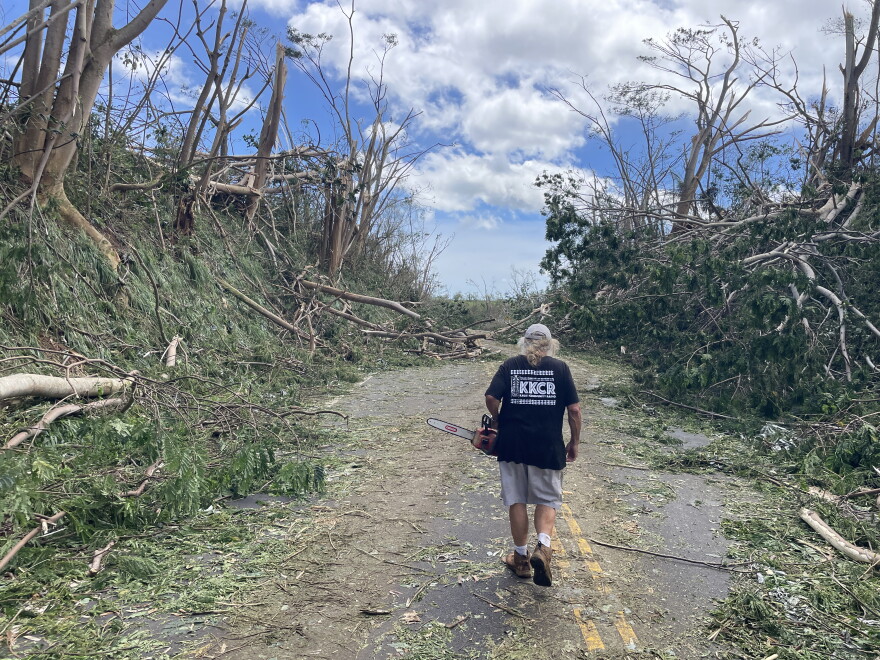 Hari Khalsa, a volunteer broadcaster with KKCR, used a chainsaw to help cut away downed trees and debris left behind by Hurricane Lowell. Debris was also left on Kuhio Highway near the station in Princeville. (September 8, 2026)
