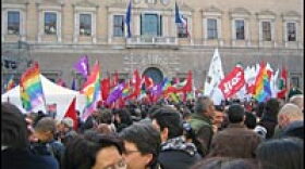 Demonstrators wave rainbow flags and shout slogans against the Vatican outside Renaissance Palace on Saturday.