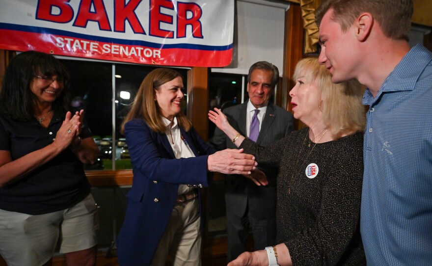 Senator Lisa Baker is congratulated by Karen Boback.