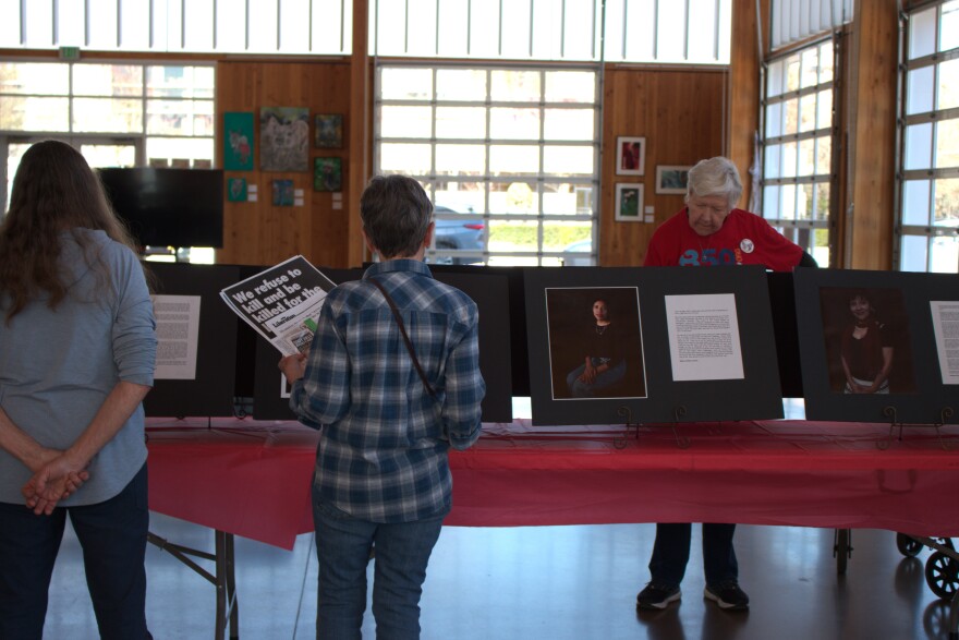 Eugene community members engage with art installations highlighting the stories of immigrants in Oregon on March 16, 2026.