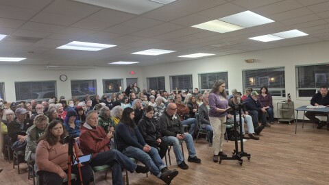 Roughly 100 people attended the Waldport City Council meeting on Dec. 10, 2025, to express their opposition any type of ICE facility in the city. The crowd spilled out into an adjacent hallway.