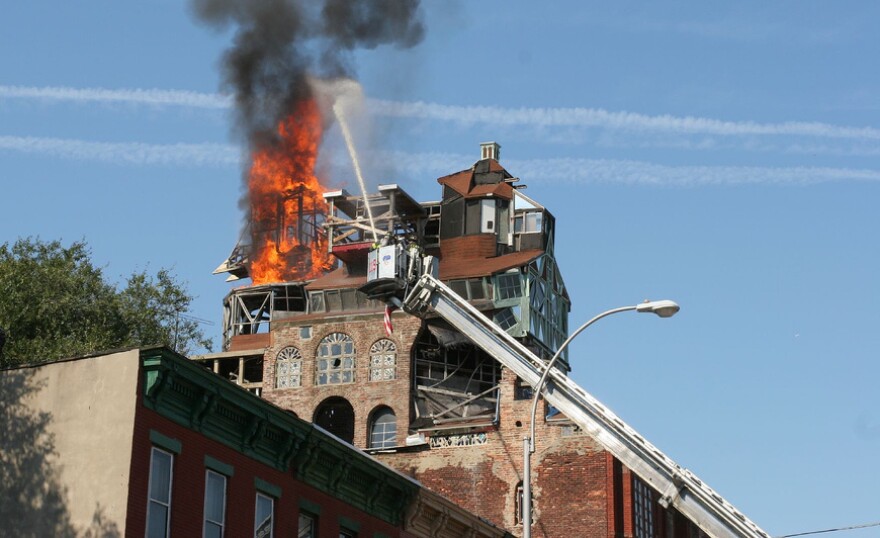 In October 2006, Broken Angel's tower caught fire. The New York City Department of Buildings declared the structure was dangerous and sought to demolish the home.