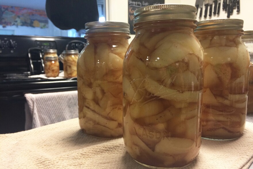 You'll hear a distinctive 'pop' when the jars seal. Then it is safe to remove the outer rings.