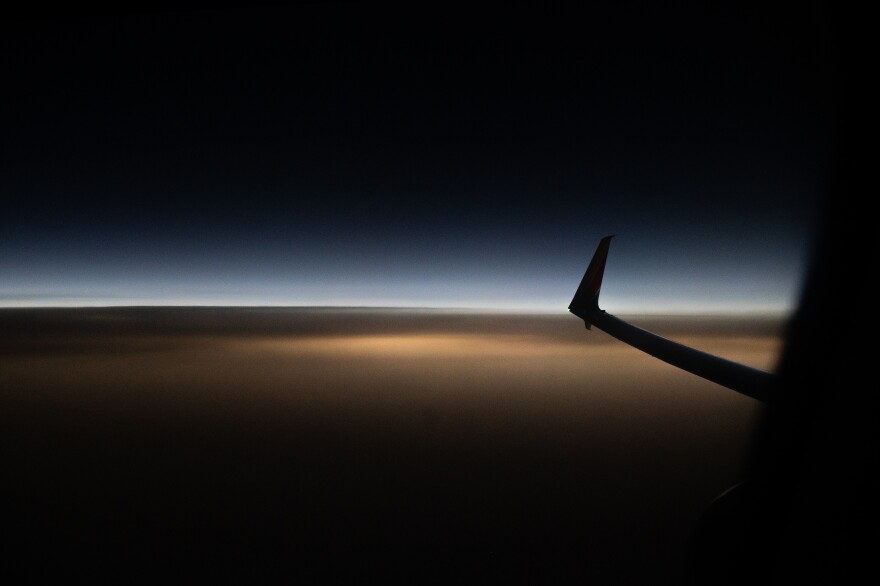 The sky is seen darkened during eclipse totality aboard Southwest Flight 1910 highlighting the total solar eclipse from St. Louis to Houston, Texas on Monday, April 8, 2024.