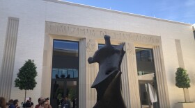 Reporters and special guests tour the courtyard of the Arkansas Museum of Fine Arts on April 18, 2023.