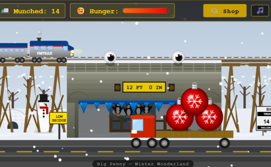 Holiday level of Big Penny Game with a truck carrying Lansing's big red balls ornament sculpture