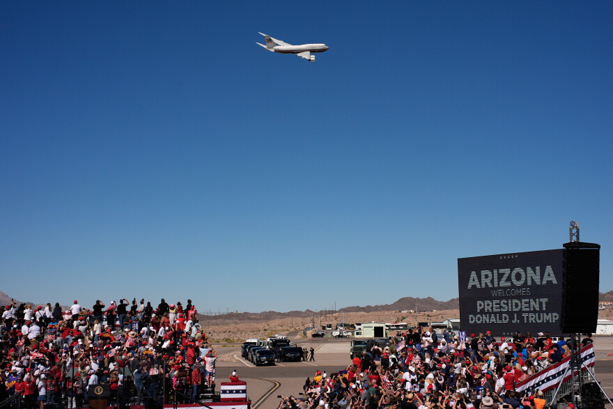 Air Force One with President Donald Trump aboard flys past before landing for a campaign rally at the Laughlin Bullhead International Airport, Wednesday, Oct. 14, 2026, in Bullhead City, Ariz.