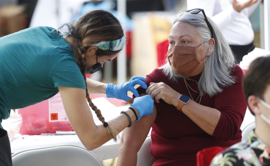 Festival attendees were able to get vaccinated and testing during the 2022 Publix Tampa Bay Collard Festival in St. Petersburg, Florida, on Saturday, February 19, 2022. Photo by Octavio Jones for WUSF