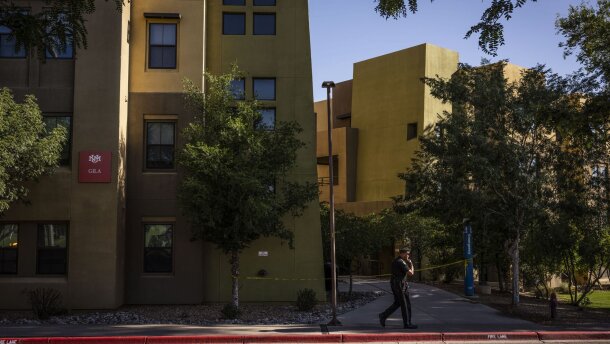 A New Mexico State Police officer at the scene of a fatal shooting in a dorm at the University of New Mexico on July 25. Recently released recordings detail contacts between Albuquerque and UNM police in the time after the shooting.