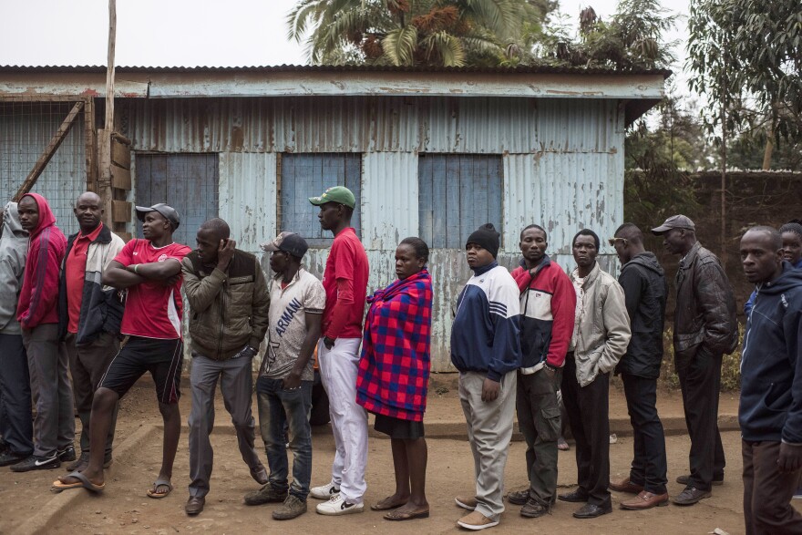 People gather to vote at Olympic Primary School in the Kibera neighborhood of Nairobi, Kenya on Tuesday.