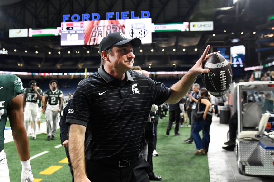 Michigan State head coach Jonathan Smith acknowledges fans as he leaves the field at the end of an NCAA college football game against Maryland, Saturday, Nov. 29, 2025, in Detroit.