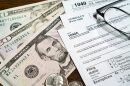 Cash and income tax paperwork.