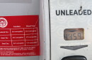 Signs on gas pumps at Giant Eagle on North High Street in Clintonville list federal and state gas taxes.