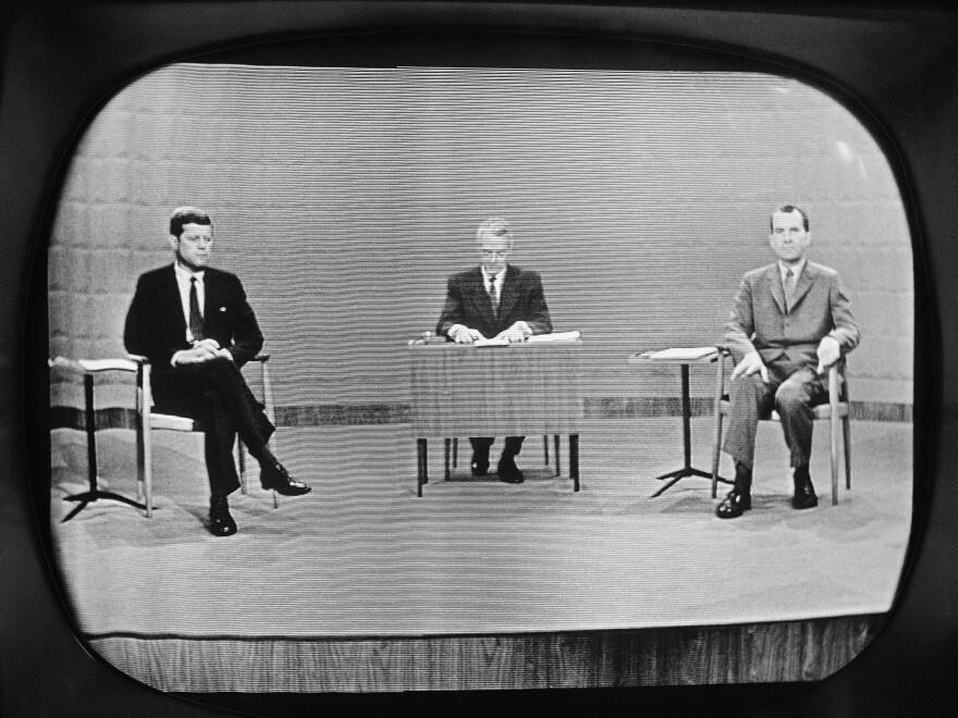 In this Sept. 26, 1960 file photo, Sen. John Kennedy, left, and Vice President Richard Nixon appear on television studio monitor set during their debate in Chicago.