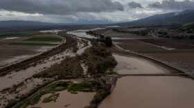 In this aerial picture taken on January 14, 2023, the Salines River overflows its banks, inundating farms near Chualar, California, as a series of atmospheric river storms continues to cause widespread destruction across the state. (David McNew/AFP via Getty Images)