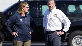 North Carolina Gov. Roy Cooper, right, and Deanne Criswell, Administrator of the U.S. Federal Emergency Management Agency, await the arrival of Democratic presidential nominee Vice President Kamala Harris for a briefing on the damage from Hurricane Helene, at Charlotte Douglas International Airport, Oct. 5, 2024, in Charlotte, N.C. 