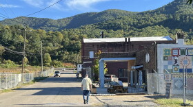 A man walks on Whitson Avenue in Swannanoa Monday. The Buncombe County Board of Commissioners took steps Tuesday to line up money to build, repair and replace sidewalks in Swannanoa’s historic business district.